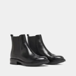 Boots basses à élastiques et détails ajourés